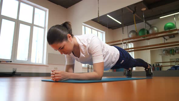 The Girl Trains in the Fitness Club