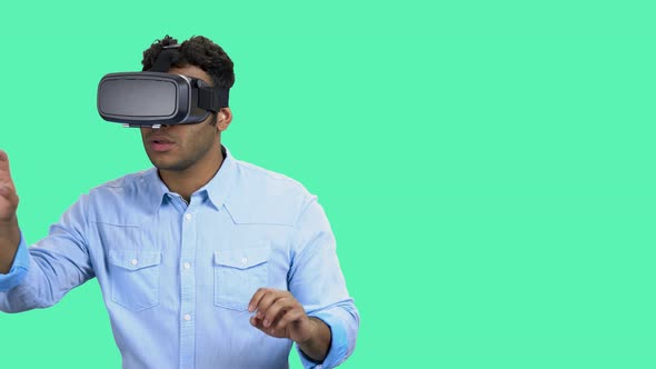 Man Wearing Vr Glasses on Color Background