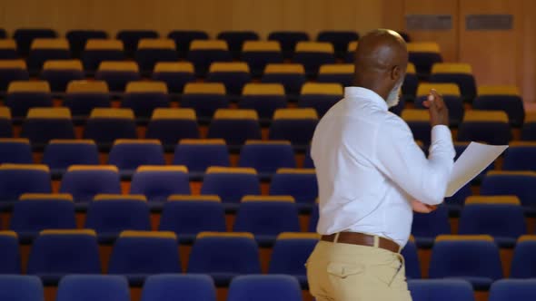 African American businessman practicing speech in empty auditorium 4k