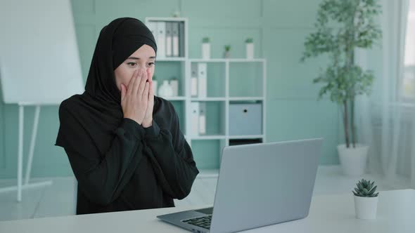 Islamic Muslim Successful Woman in Black Hijab Celebrate Victory Triumph Look at Laptop Screen