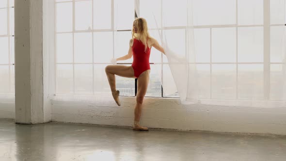 Beautiful Ballerina Stretching and Warming Up