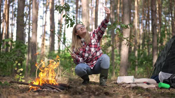 Cheerful Confident Blogger Traveler Talking Smiling Filming Video on Smartphone Frying Mushroom on