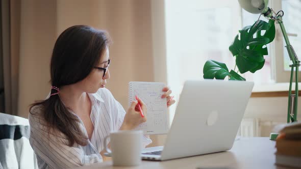 Young Woman School Teacher Working Remotely From Home Using Her Laptop