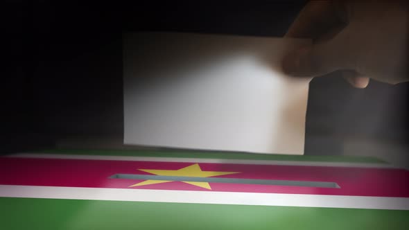 Digital Composite Hand Voting To National Flag OF Suriname 