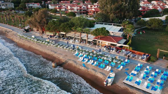 Picturesque holiday resort on sandy beach, reveal of hotel building at Kusadasi, Turkey