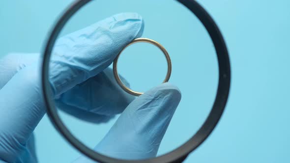 Inspecting Jewerly with a Magnifying Glass