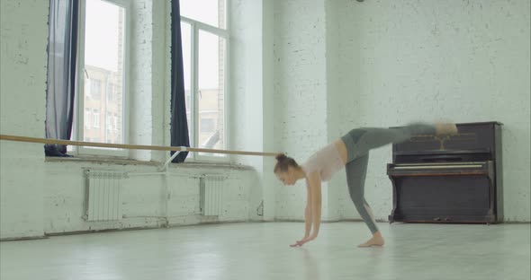 Elegant Sporty Woman Doing Cartwheel Exercise