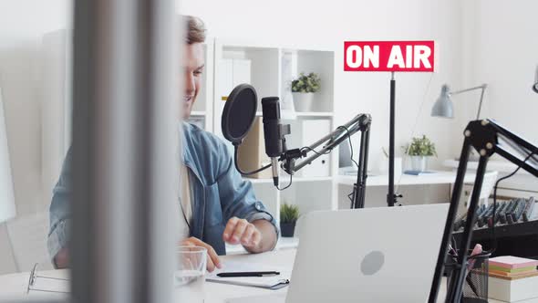 Radio Host Finishing Broadcast in Studio