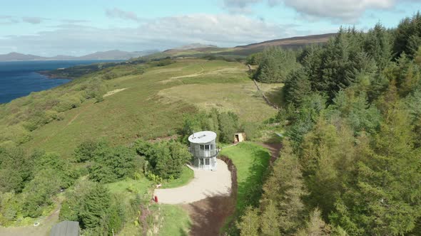 AERIAL - establishing shot of a quirky aluminum house in Scotland