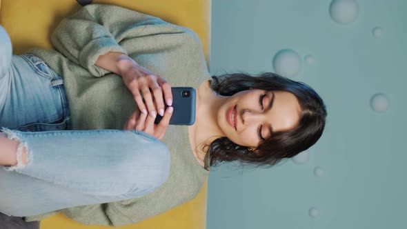 Woman Holding Smartphone and Writing a Message Chating in Social Media