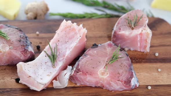 Raw Fresh Fish on a Chopping Board for Preparing for Cooking on Table