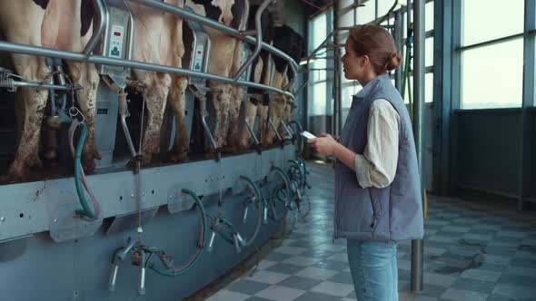 Farmer Control Milking Process Holding Tablet Computer