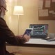 man works at a stock market through a laptop - VideoHive Item for Sale