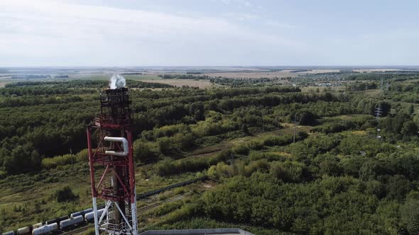 A Tower for Flaring Associated Gas at a Petrochemical Plant. Fiery Torch.