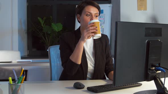 Businesswoman Drinking Coffee at Night Office 68