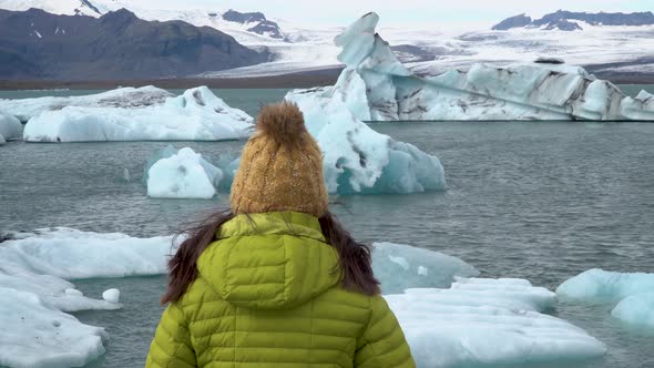 Tourist on Iceland Looking at Jokulsarlon Glacier Lagoon