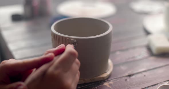 The Potter Decorate Clay Cup By Knife Tool