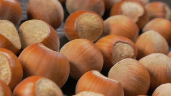 Hazelnut shells on wooden table dolly 4K 3840X2160 UHD footage - Hazelnuts on table close-up dolly s