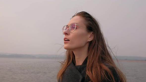 Female Inhale Fresh Air on River Background