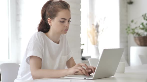 Casual Young Woman Standing and Leaving Couch