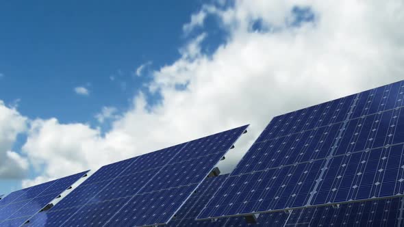 Solar Panels Cells Against Skyline Timelapse at the Alternative Energy Farm