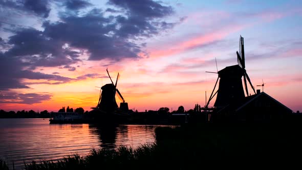 Windmills at Zaanse Schans in Holland on Sunset. Zaandam, Nether