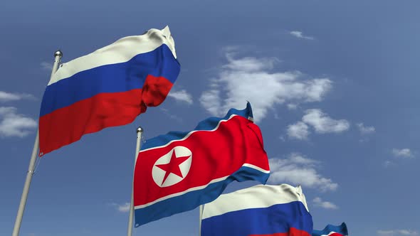 Waving Flags of North Korea and Russia