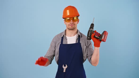 Man in Hard Hat Protective Goggles and Gloves