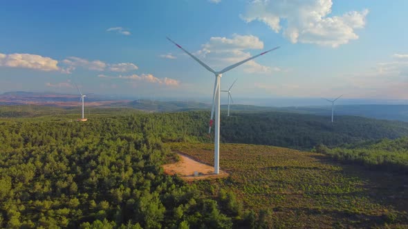 Drone Flies Over a Windmill Park