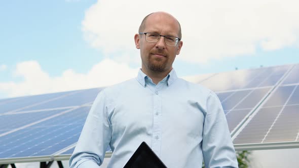 Portrait of Confident Engineer of Solar Cell Farm Industry