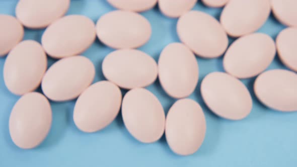 Pink Oval Pill for Pregnant Women Lying