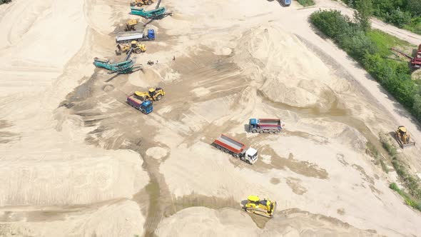 Mining conveyor at sand quarry. Aerial view of mining machinery. Mining industry