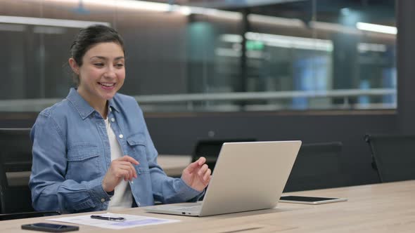 Indian Woman Talking on Video Chat on Laptop