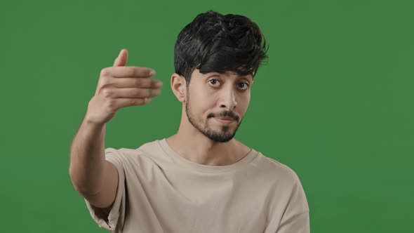 Portrait of Hospitable Man Indian Arab Guy Make Invite Hand Gesture Ask to Come Closer Shows Welcome