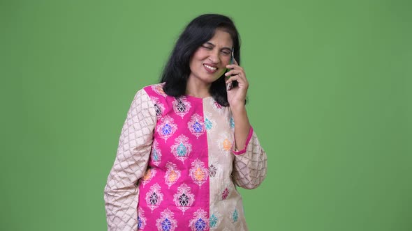 Mature Happy Beautiful Indian Woman Talking on the Phone