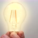 Caucasian Man Holding Glowing Incandescent Light Bulb - VideoHive Item for Sale