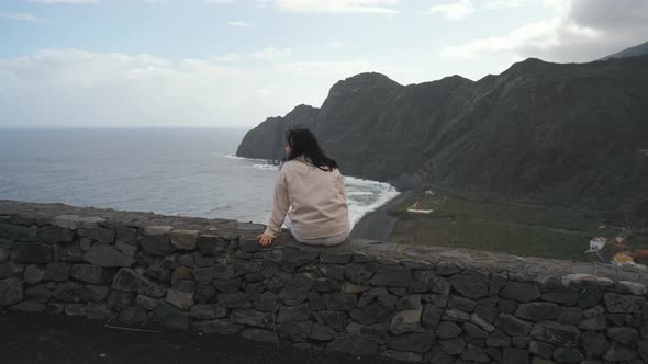 Woman Sits on the Observation Deck on the Canarian Island of La Gomera