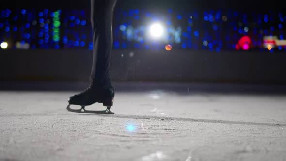 Figure Skating Professional Man Gymnast Performs a Trick on Ice Man Spinning on Skates a View of the