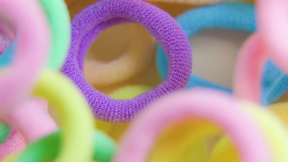 Vertical Shot of a Vibrant Colors Rotating Close Up Rubber Bands