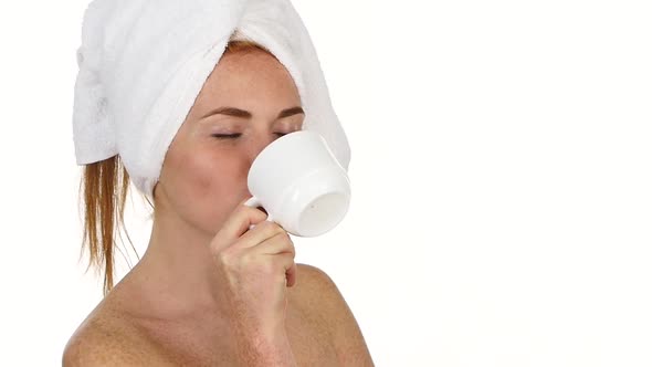 Girl Is Drinking Coffee, She Has Towel on Her Head, Slow Motion