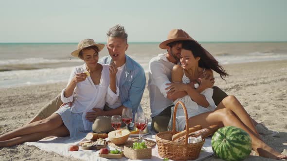 Lovely Couples Having Fun at Sea Vacation Travel and Kissing