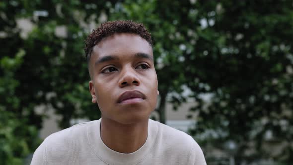 Face Portrait of Hispanic Latin Teenager Boy Sitting Outdoor