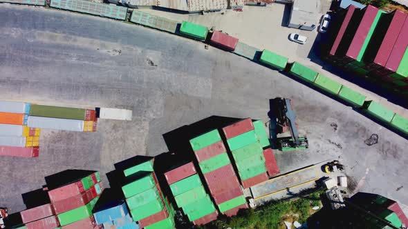 Forklift Truck Lifting Cargo Container in Dock Yard for Transportation Import Export and Logistic