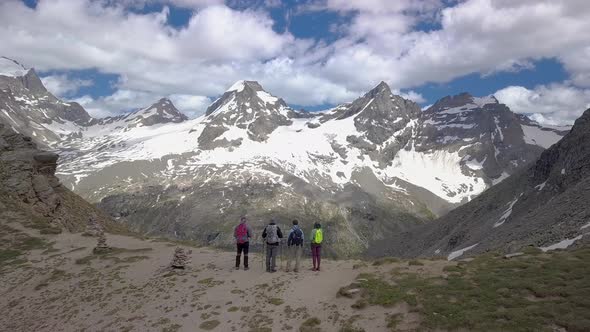 Tourists on a Pass in the Alps