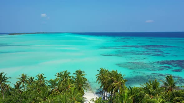 Wide overhead island view of a summer white paradise sand beach and blue ocean background in best qu