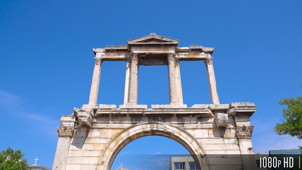 Camera tilt down and away from Hadrian's Gate in Athens, Greece