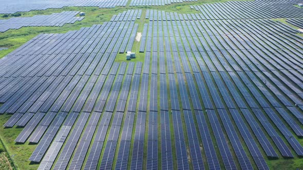 Aerial view of Ecology solar power station panels in the fields green energy. Landscape electrical i