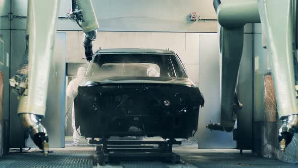 Robots Painting a Car Body at the Automated Car Production Line