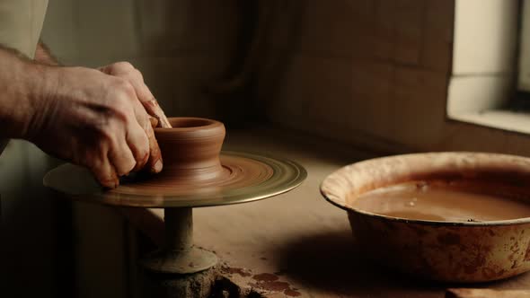 Man Sculpting in Pottery on Master Class