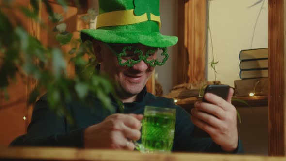 Man Drinking Green Beverage Celebrating Saint Patrick's Day